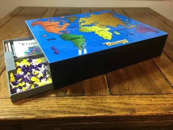 Game pieces stored in box drawer